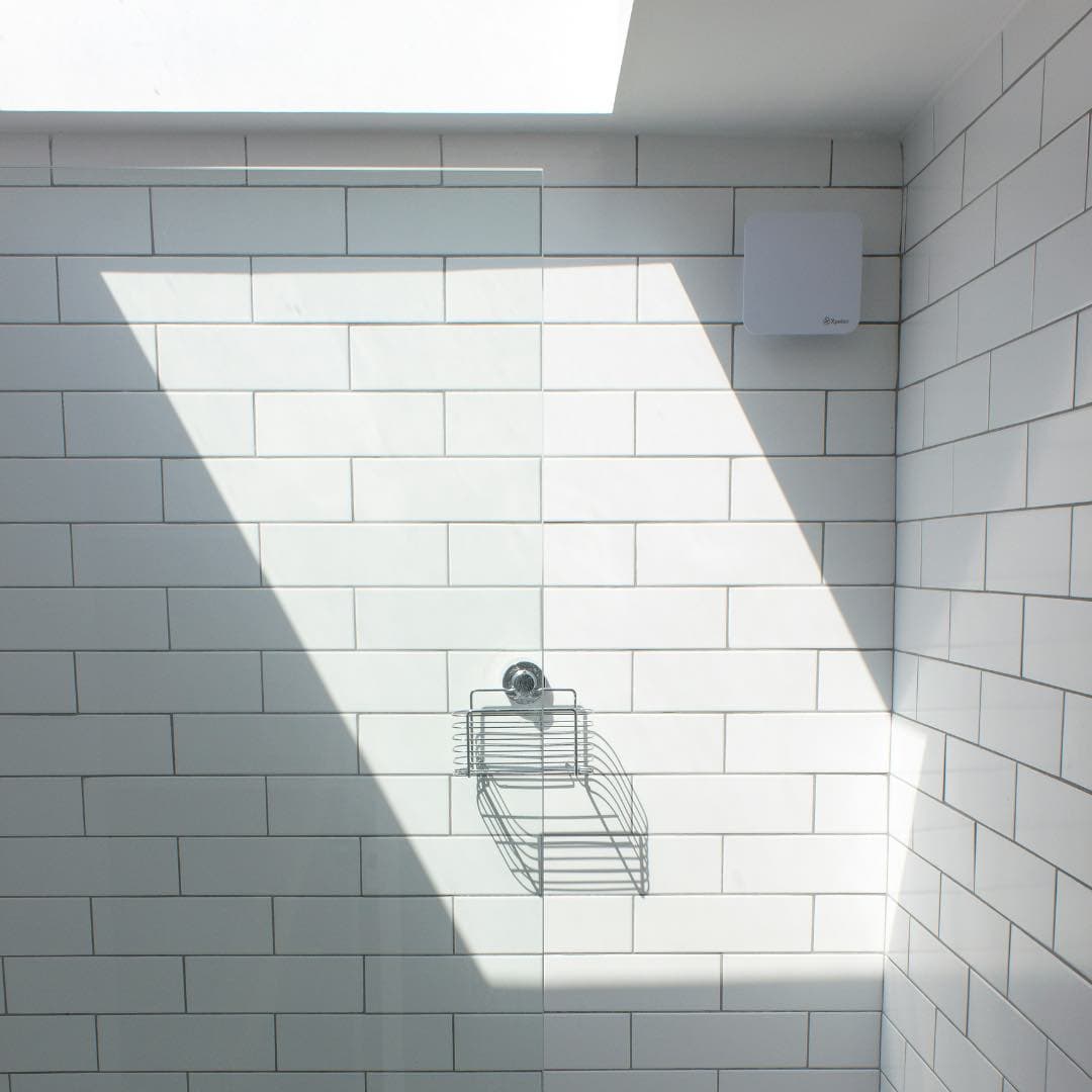 Daylight coming through light tunnel into bathroom